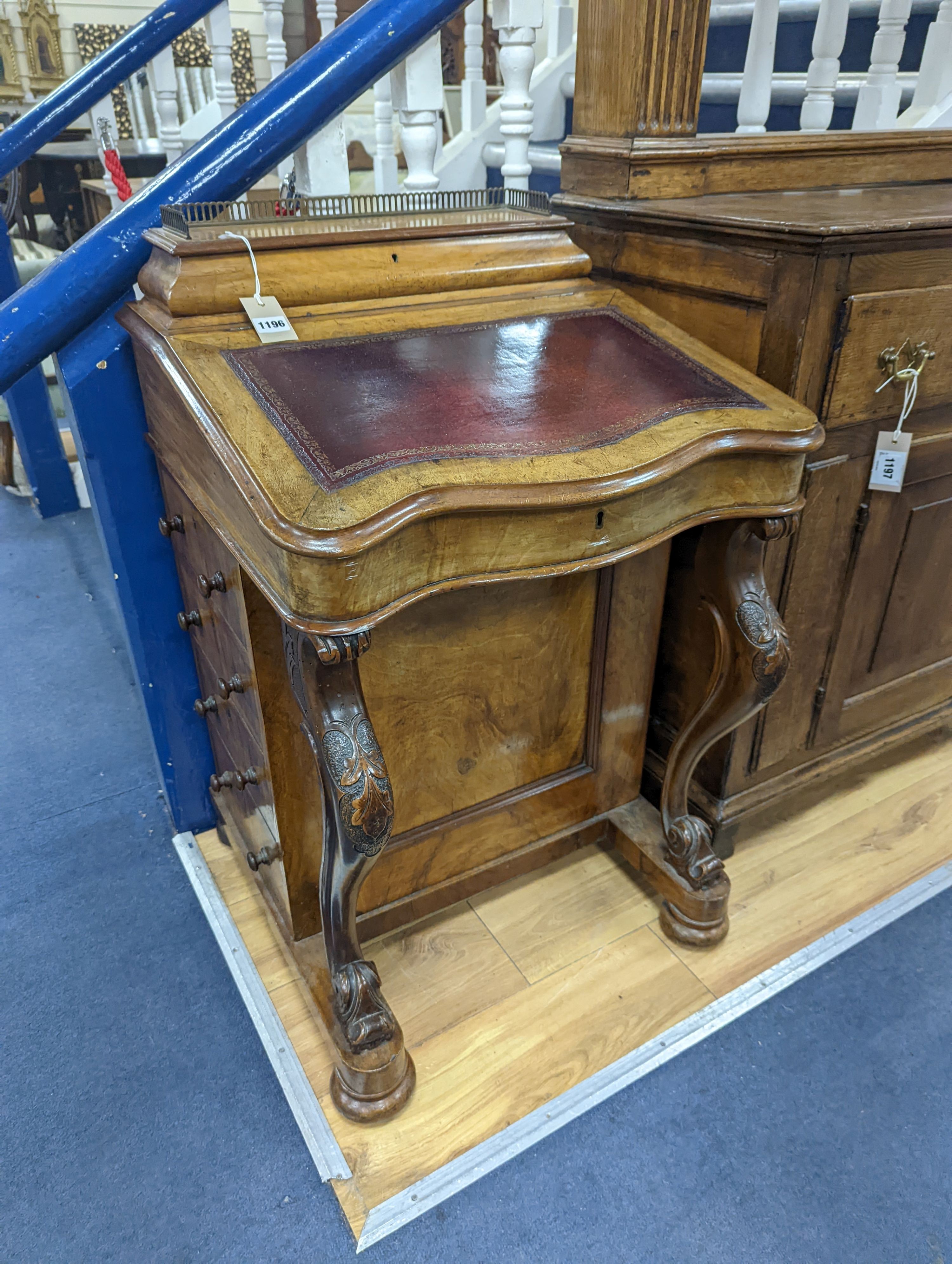 A Victorian walnut Serpentine fronted Davenport, width 55cm
